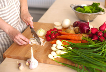 Young Woman Cooking in the kitchen. Healthy Food