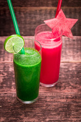 Fresh red and green smoothie on vintage wooden background.Healthy detox drink