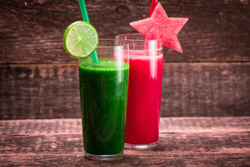 Fresh red and green smoothie on vintage wooden background.Healthy detox drink