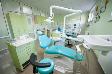 Modern dental clinic with three dental chairs and equipments
