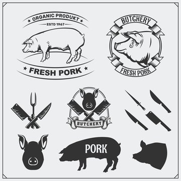 Vector pork meat labels and design elements. Butcher's business logos. Silhouettes of pig and cutlery.