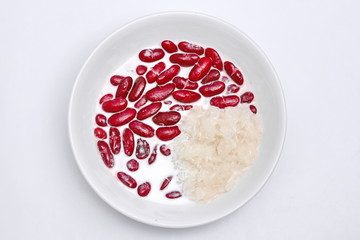 Red bean with Thai sticky rice in coconut cream on white background.