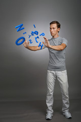 Man working with a set of letters, writing concept.