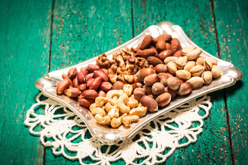 Mix nuts on wooden table,healthy vegan food.
