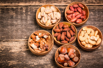 Mix nuts on wooden table,healthy vegan food.