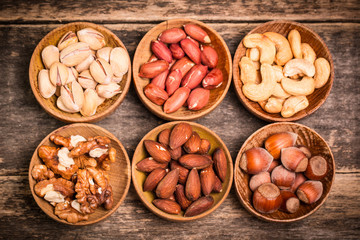 Mix nuts on wooden table,healthy vegan food.