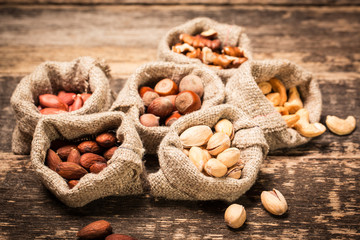 Mix nuts on wooden table,healthy vegan food.