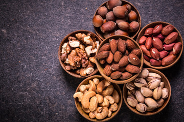 Mix nuts on wooden table,healthy vegan food.