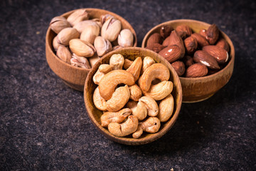Mix nuts on wooden table,healthy vegan food.