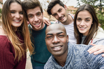 Fototapeta premium Multiracial group of friends taking selfie