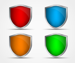 Set of icons of different colors and shapes of shields