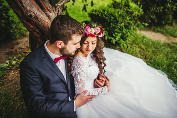 Bride & groom near old tree