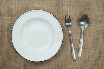 Table setting. silverware and plate on table.