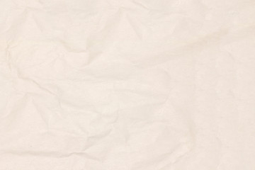 Recycled crumpled light brown paper texture or paper background for design with copy space for text or image.