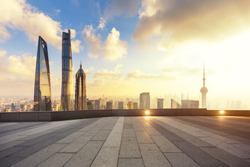 Fototapeta na wymiar cityscape and skyline of shanghai from empty brick floor