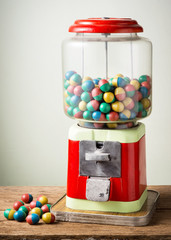 gamble eggs in vintage coin operated gumball machine and a few on old wood