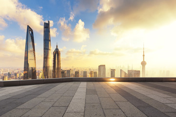 Obraz premium cityscape and skyline of shanghai from empty brick floor