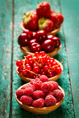 Fresh summer berries , wooden background, healthy food.
