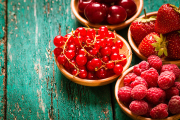 Fresh summer berries , wooden background, healthy food.