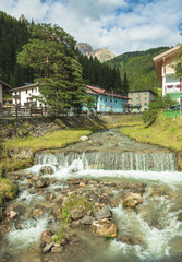 Fototapeta na wymiar mountain river flowing through village