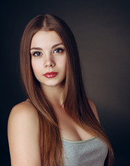 
Portrait of a young beautiful brunette girl with long  hair