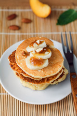 Fototapeta na wymiar Pancakes with bananas and caramel