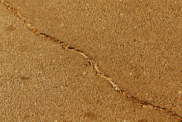 Cracked color asphalt surface.