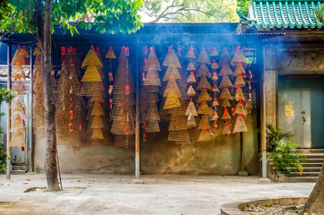Incense coils hang in Chinese temple - selective focus