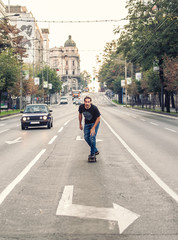 Professional skateboarder riding a skateboard slope on the capital city streets