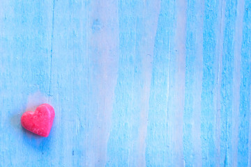 Valentines Day background with shugar valentine heart on blue painted wood table.Retro filter