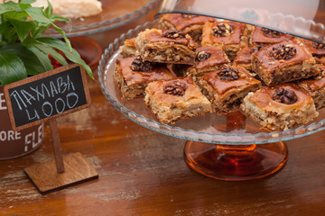 square biscuits with nuts in a glass vase and flower pot
