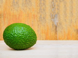 fresh organic avocado on wood table