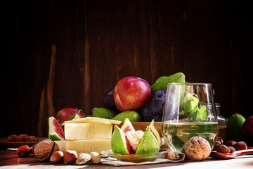 Autumn buffet table. Snacks for white wine: cheese, fruit, nuts
