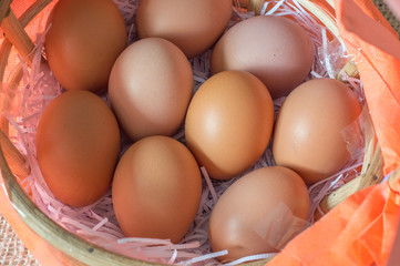 Eggs in bamboo basket on jute sack