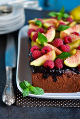 Chocolate cake with raspberries, figs, peaches and chocolate. Se
