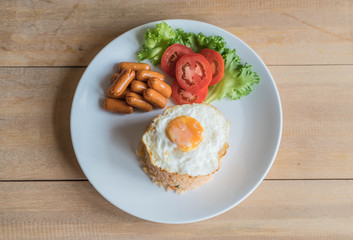 fried rice with sausage and fried egg
