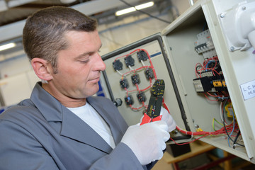 Electrician using cable strippers