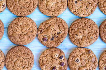 Finished cookies right out of the oven. Flat lay on rustic light blue painted wooden background