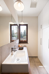 Fototapeta na wymiar Toilet with window and white lockers