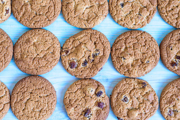 Finished cookies right out of the oven. Flat lay on rustic light blue painted wooden background
