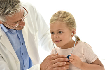 Little girl at the doctor's, using stethoscope