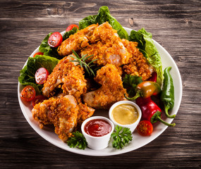 Fried chicken nuggets and vegetables