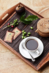 Espresso Coffee Drink in cup on a wooden tray.