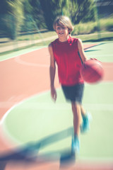 Fototapeta premium basketball player - blurred vintage filtered photo 