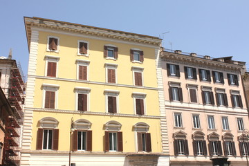 Fototapeta na wymiar Windows of old house. Mediterranean architecture in Rome, Italy.