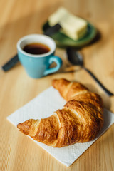 Breakfast with coffee and croissant