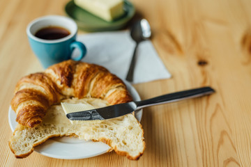 Breakfast with coffee and croissant