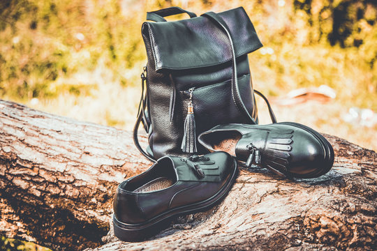 black leather shoes and a backpack, women's shoes