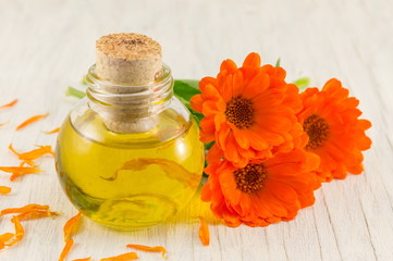 marigold oil with a fresh flower bouquet