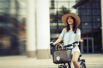 Tourist woman using bicycle